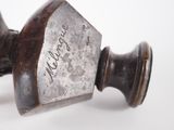 an image of a close up of a metal object on a white surface