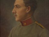 portrait of a man in a military uniform with a red star on his collar
