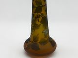 a glass vase with a design on it on a white surface