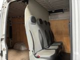 two seats in the back of a van with the door open