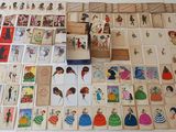a lot of cards on the table with pictures on them