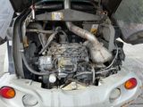 a small car with a large engine in the back of it