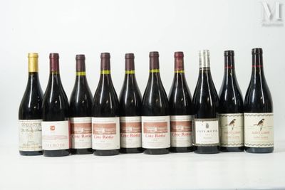 several bottles of wine are lined up on a table
