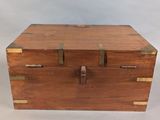 an old wooden box with brass handles on a white background