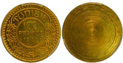 a close up of two gold coins on a white background