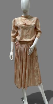 an image of a mannequin dressed in a peach dress