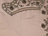 an image of a piece of embroidered fabric with a crown on it