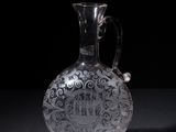 a glass vase that is sitting on a table