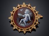 an image of a broochle with a cher and a bird