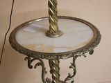 a table with a lamp on top of it on a table