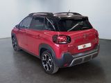 the red citrole suv is parked in a large room