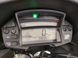 a close up of a motorcycle with a speedometer on it ' s dashboard