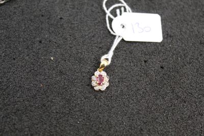 a close up of a necklace on a black surface with a price tag