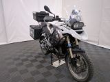 a motorcycle that is parked on a black and white checkered floor