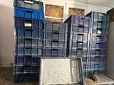 a lot of crates that are stacked up on the counter