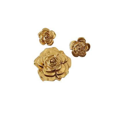 a close up of a bunch of gold flowers on a white background