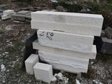 a pile of white bricks sitting on the ground