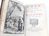 an open book with a picture of a group of people on it