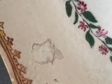 an image of a plate with flowers on it sitting on a table