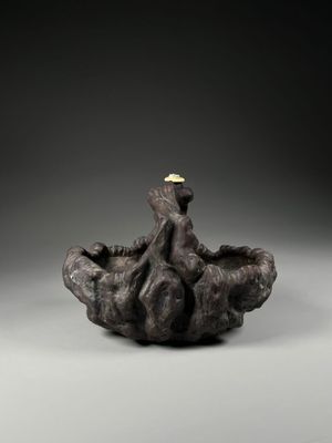 a close up of a sculpture of an octopus on a rock