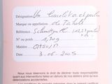 blond woman holding up a pink card with writing on it