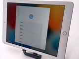 tablet computer sitting on top of a table with a login page on the screen