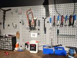 a picture of a workbench with tools hanging on the wall