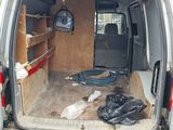 the back of a van with the back door open and the back of the van with the door open
