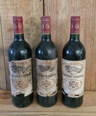 three bottles of wine sitting on a shelf next to each other