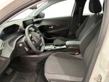 the interior of a car with a steering wheel and a dashboard