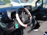 dashboard of a car with a steering wheel and a steering wheel in the passenger seat
