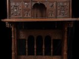 an old wooden desk with a carved top and two drawers