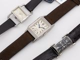 three different types of watches are displayed on a white surface