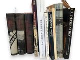 many books that are on a shelf on the wall