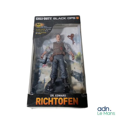 toy figure of a man with a gun in a plastic package