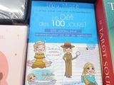 several children ' s books in a box on a table