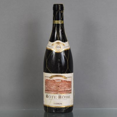 a bottle of wine that is sitting on a table