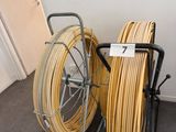 a cart with a lot of hoses on it in a room