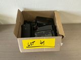 a cardboard box with a lot of cell phones inside of it