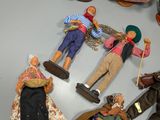 many dolls that are arranged in a circle on a table