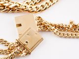 a gold chain with a usb drive attached to it