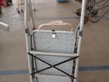 a cart that has a sign on it in a warehouse