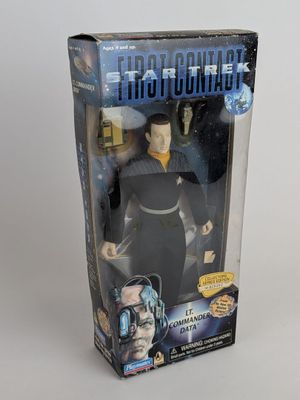 a close up of a toy figure in a box on a table