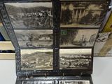 a black and white photo of a suitcase with pictures inside of it