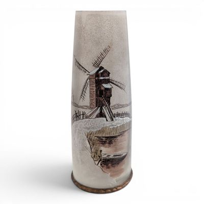 a tall vase with a windmill on it
