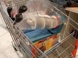 a shopping cart that has some items inside of it