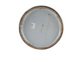 a white plate with a brown rim on a white surface