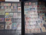 many different types of stamps on the pages of a book