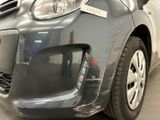 the front bumper of a car with a sticker on it ' s bumper