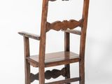 an old wooden chair with a wooden seat on a white background